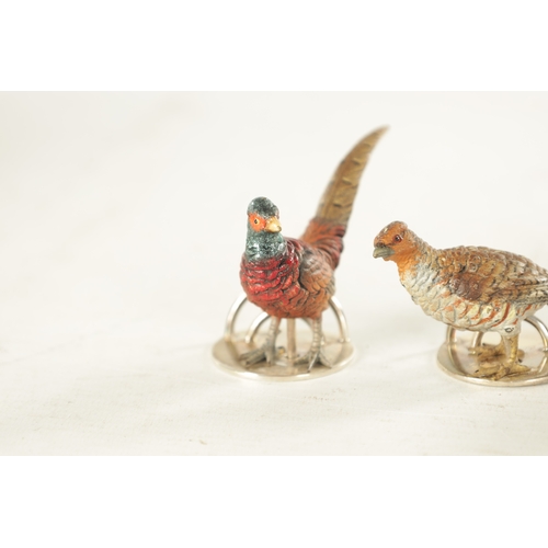 244 - A CASED SET OF FOUR COLD-PAINTED BRONZE AND SILVER METAL GAME BIRD MENU HOLDERS mounted on circular ... 