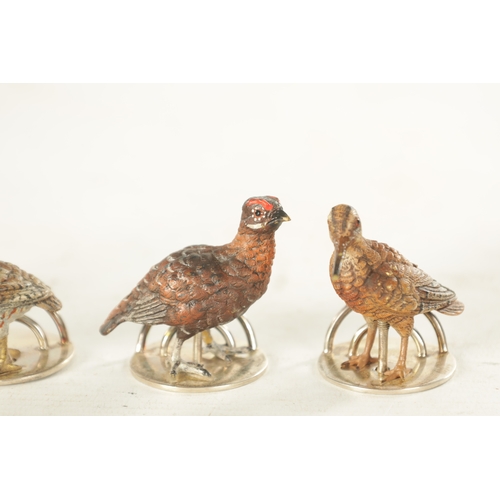 244 - A CASED SET OF FOUR COLD-PAINTED BRONZE AND SILVER METAL GAME BIRD MENU HOLDERS mounted on circular ... 