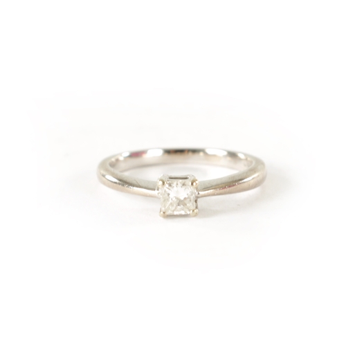 247 - AN 18CT WHITE GOLD DIAMOND SOLITAIRE RING, with square cut diamond in a four claw setting. Total wei... 