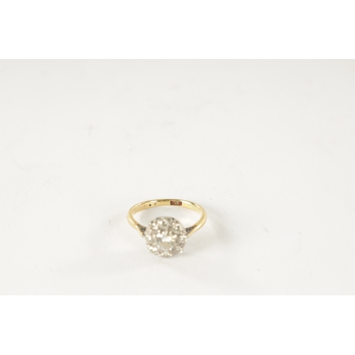 252 - AN 18CT GOLD AND DIAMOND DAISY RING, with an app. 0.5ct centre stone surrounded by eight smaller sto... 