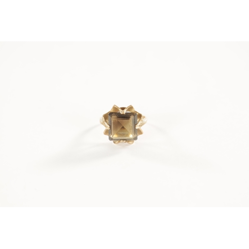 254 - A LARGE 9CT GOLD SMOKEY QUARTZ RING with stylish textured four-claw setting and large square cut qua... 