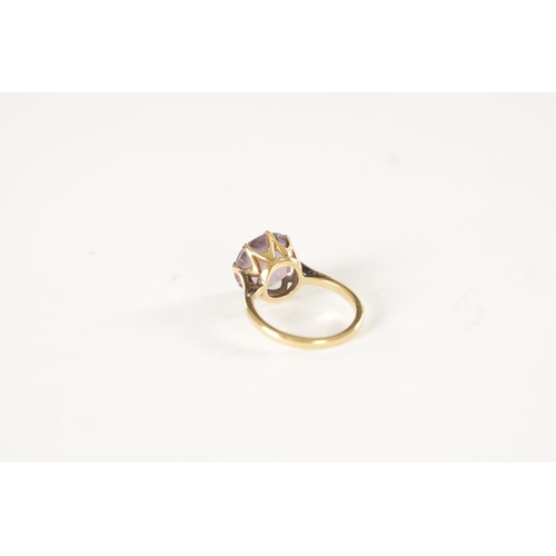 256 - AN 18CT GOLD AND AMETHYST RING with claw setting - stamped 18ct, size K, 3.8 grams approx.