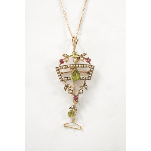 259 - A LATE 19TH CENTURY 9 CT GOLD SUFFRAGETTE PENDANT NECKLACE, the open work floral frame set with peri... 