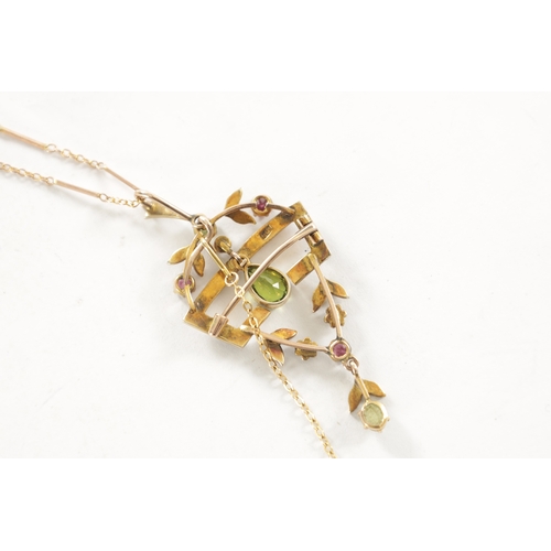 259 - A LATE 19TH CENTURY 9 CT GOLD SUFFRAGETTE PENDANT NECKLACE, the open work floral frame set with peri... 