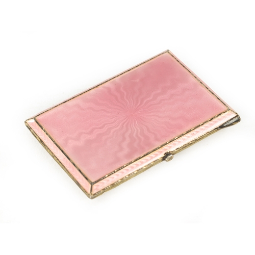 268 - AN ART DECO SILVER AND PINK GUILLOCHE ENAMEL CIGARETTE CASE, with chamfered edge and gilt interior. ... 