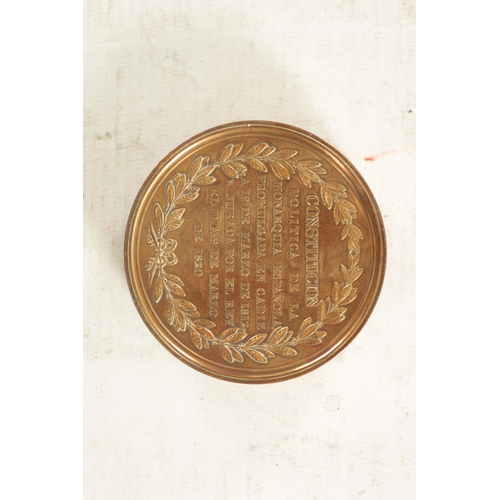 286 - A 19TH CENTURY SPANISH GILT BRASS 'PORTRAIT' SNUFF BOX of circular form embossed to the lid with the... 