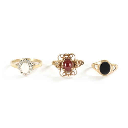 294 - A COLLECTION OF THREE 9CT GOLD RINGS, comprising of a gold ring with pierced end scrollwork setting ... 