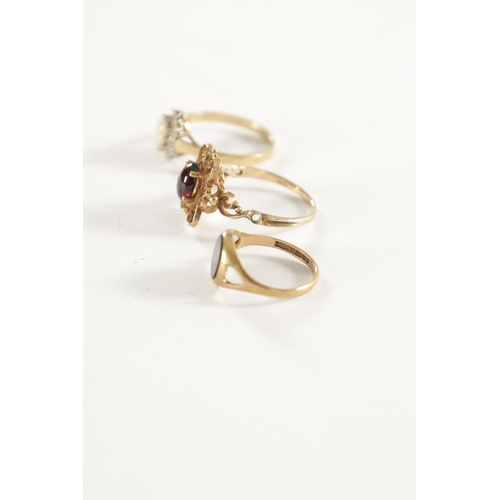 294 - A COLLECTION OF THREE 9CT GOLD RINGS, comprising of a gold ring with pierced end scrollwork setting ... 