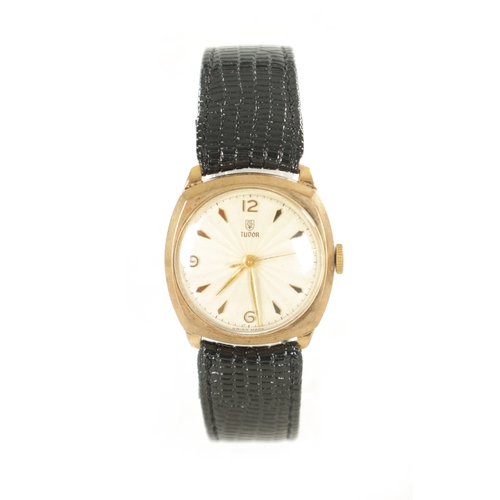 297 - A GENTLEMAN’S 1950’S 9CT GOLD CUSHION CASED ROLEX TUDOR WRISTWATCH, on black strap, the champagne en... 