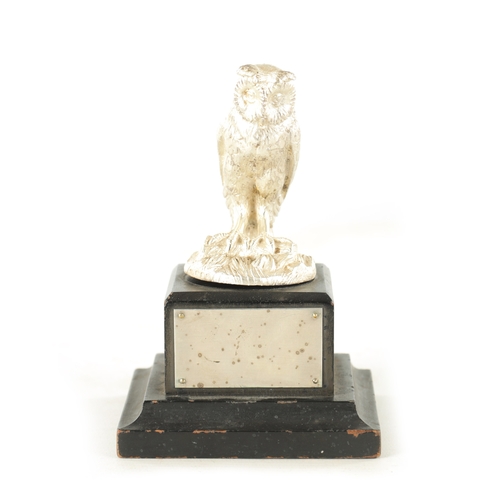 372 - AN ELIZABETH II CAST SILVER SCULPTURE OF AN OWL realistically modelled with a matt finish perched on... 