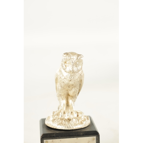 372 - AN ELIZABETH II CAST SILVER SCULPTURE OF AN OWL realistically modelled with a matt finish perched on... 