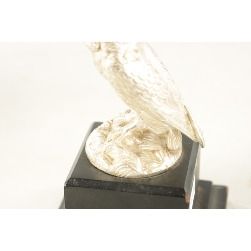 372 - AN ELIZABETH II CAST SILVER SCULPTURE OF AN OWL realistically modelled with a matt finish perched on... 