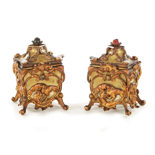 666 - A PAIR OF LATE 19TH CENTURY FRENCH GILT METAL AND MOTHER-OF-PEARL PANELLED CASKETS set with tiger's ... 