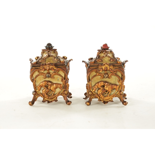 666 - A PAIR OF LATE 19TH CENTURY FRENCH GILT METAL AND MOTHER-OF-PEARL PANELLED CASKETS set with tiger's ... 