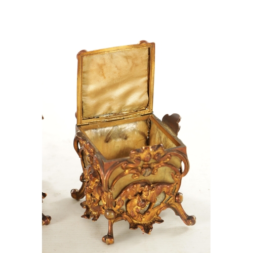 666 - A PAIR OF LATE 19TH CENTURY FRENCH GILT METAL AND MOTHER-OF-PEARL PANELLED CASKETS set with tiger's ... 