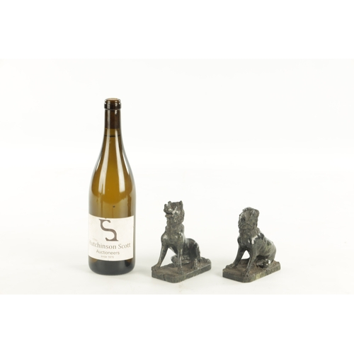 668 - A PAIR OF 19TH CENTURY SERPENTINE MARBLE SCULPTURES, modelled as seated dogs on rectangular bases. (... 