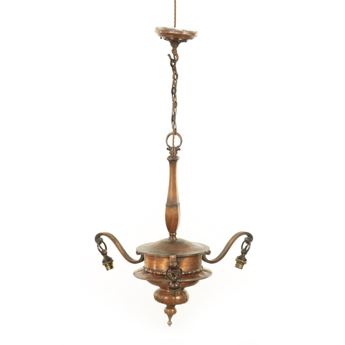 670 - AN EARLY 20TH CENTURY COPPER THREE BRANCH CHANDELIER WITH VASALINE SHADES with shaped turned column ... 