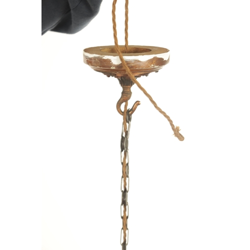 670 - AN EARLY 20TH CENTURY COPPER THREE BRANCH CHANDELIER WITH VASALINE SHADES with shaped turned column ... 