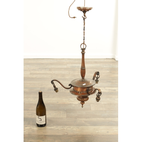 670 - AN EARLY 20TH CENTURY COPPER THREE BRANCH CHANDELIER WITH VASALINE SHADES with shaped turned column ... 