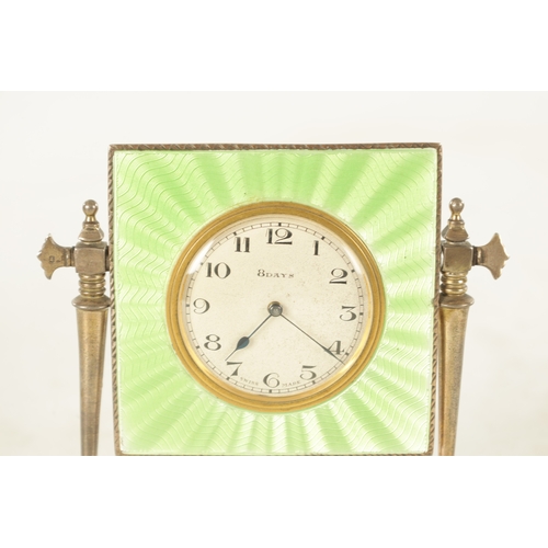 1006 - A SILVER AND GUILLOCHE ENAMEL MANTEL CLOCK the lime green case supported on two silver pillars mount... 