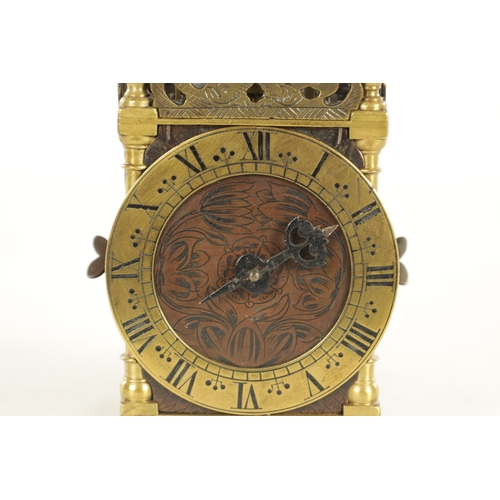 1011 - A RARE LATE 17TH CENTURY MINIATURE ENGLISH LANTERN CLOCK surmounted by a bell supported on brass str... 