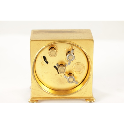 1017 - A 1930'S ZENITH WATCH CO. SWISS BOUDOIR TRAVELLING ALARM CLOCK the plain square gilt brass case on b... 