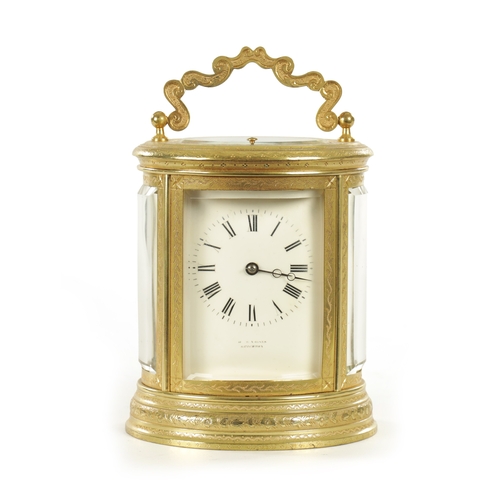 1028 - A LATE 19TH CENTURY FRENCH ENGRAVED OVAL CASED REPEATING CARRIAGE CLOCK the brass case with foliate ... 