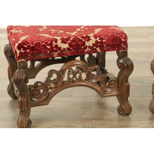 1388 - A PAIR OF 17TH CENTURY AND LATER WALNUT UPHOLSTERED STOOLS with arched leaf-carved stretchers and sc... 