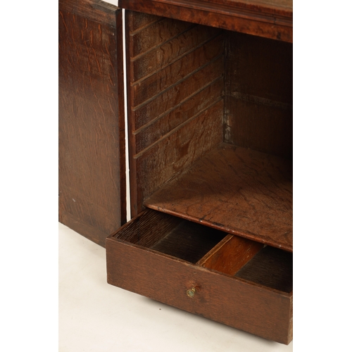 1392 - A WILLIAM AND MARY BURR WALNUT HANGING CUPBOARD the moulded cornice above a pair of hinged doors enc... 