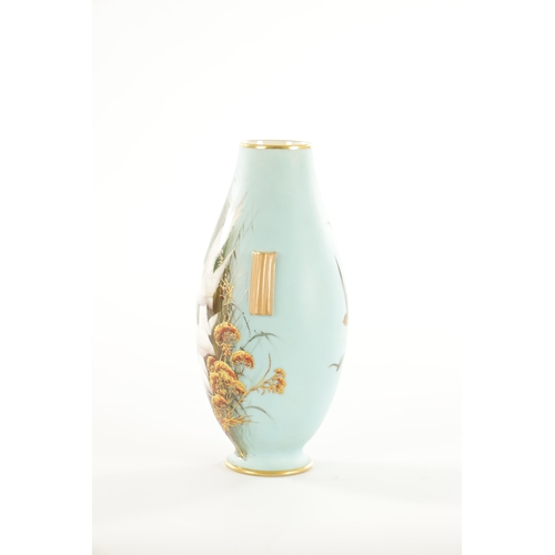 39 - AN EARLY 20TH CENTURY ROYAL WORCESTER CABINET VASE BY C. BALDWYN decorated with swans in flight on a... 