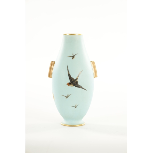 39 - AN EARLY 20TH CENTURY ROYAL WORCESTER CABINET VASE BY C. BALDWYN decorated with swans in flight on a... 