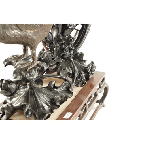 135 - AN IMPRESSIVE 19TH CENTURY CHINESE CARVED HARDWOOD AND BRONZE MOUNTED SCULPTURE with overhanging flo... 