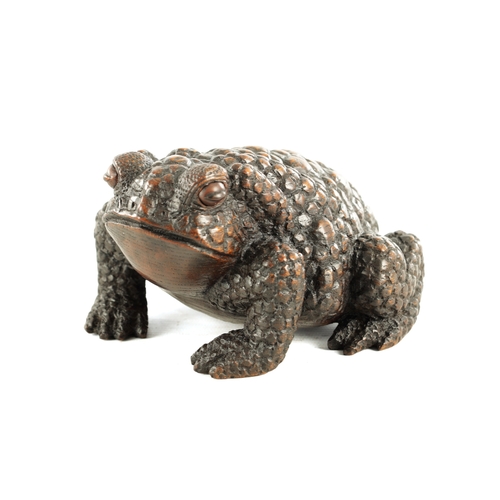 194 - A JAPANESE MEIJI PERIOD CARVED WOOD OKIMONO OF A TOAD realistically modelled with signature beneath.... 