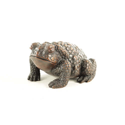 194 - A JAPANESE MEIJI PERIOD CARVED WOOD OKIMONO OF A TOAD realistically modelled with signature beneath.... 