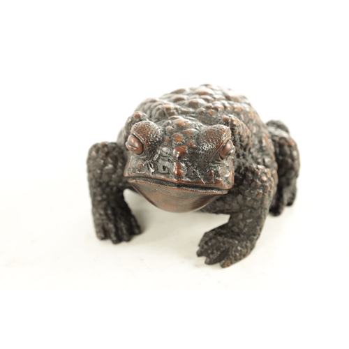 194 - A JAPANESE MEIJI PERIOD CARVED WOOD OKIMONO OF A TOAD realistically modelled with signature beneath.... 