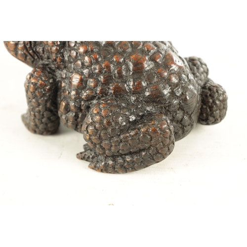 194 - A JAPANESE MEIJI PERIOD CARVED WOOD OKIMONO OF A TOAD realistically modelled with signature beneath.... 