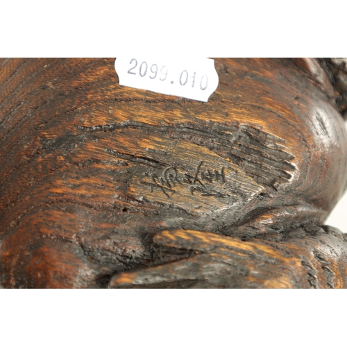 194 - A JAPANESE MEIJI PERIOD CARVED WOOD OKIMONO OF A TOAD realistically modelled with signature beneath.... 