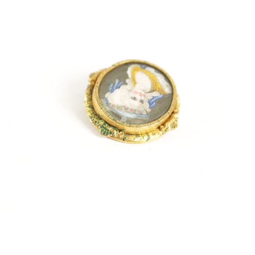 271 - A 19TH CENTURY MINIATURE PORTRAIT BROOCH depicting the head and shoulders of a young lady - in a gol... 