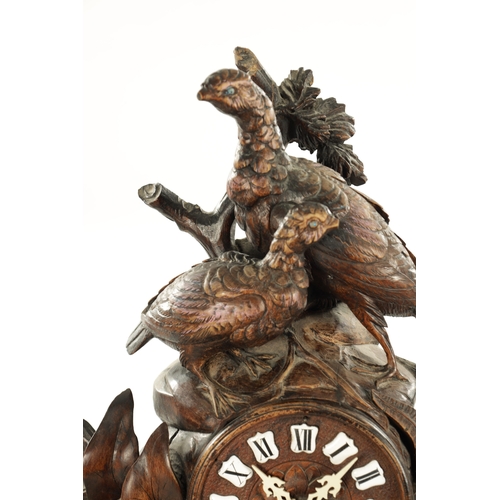 1010 - A 19TH CENTURY BLACK FOREST CARVED LINDEN WOOD MANTEL CLOCK with a family of grouse amongst foliage ... 