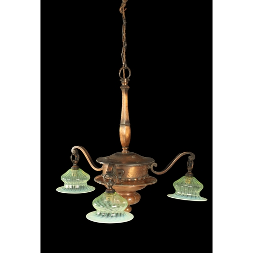 670 - AN EARLY 20TH CENTURY COPPER THREE BRANCH CHANDELIER WITH VASALINE SHADES with shaped turned column ... 