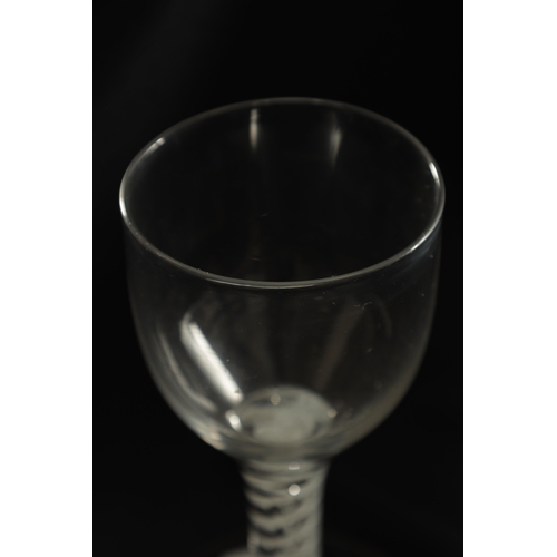 1 - AN 18TH CENTURY STYLE OVERSIZED WINE GLASS the slight ogee bowl on a double opaque cable twist stem ... 