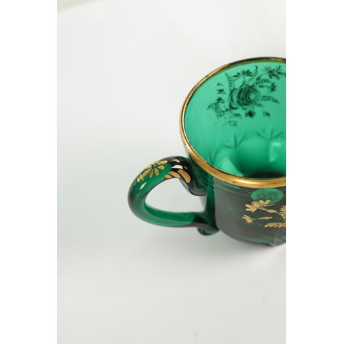 10 - A PAIR OF LATE GEORGIAN BRISTOL GREEN GLASS CUPS IN THE MANNER OF JAMES GILES the facetted and cut l... 