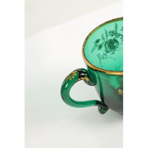 10 - A PAIR OF LATE GEORGIAN BRISTOL GREEN GLASS CUPS IN THE MANNER OF JAMES GILES the facetted and cut l... 