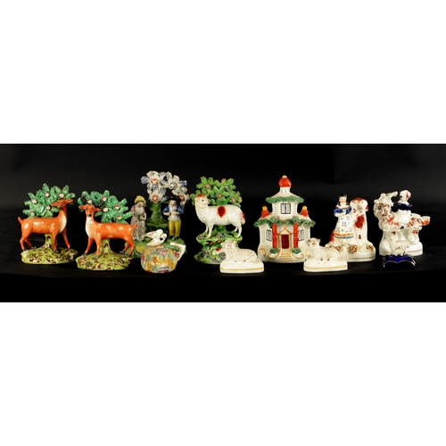 101 - A GROUP OF ELEVEN 19TH CENTURY STAFFORDSHIRE FIGURES including a pair of deer and sheep examples (16... 