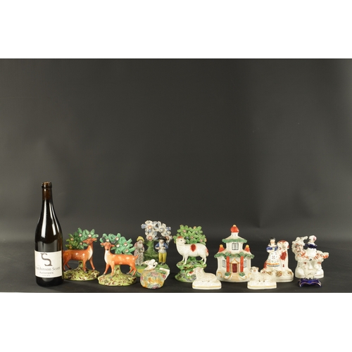 101 - A GROUP OF ELEVEN 19TH CENTURY STAFFORDSHIRE FIGURES including a pair of deer and sheep examples (16... 