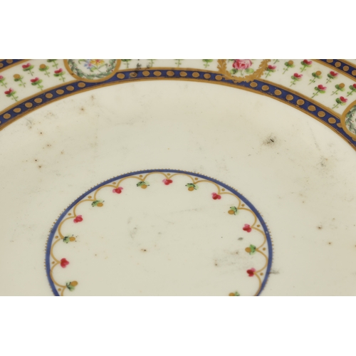 104 - TWO 19TH CENTURY WEDGWOOD HAND-PAINTED CABINET PLATES with bands of flowers highlighted in gilt (26c... 