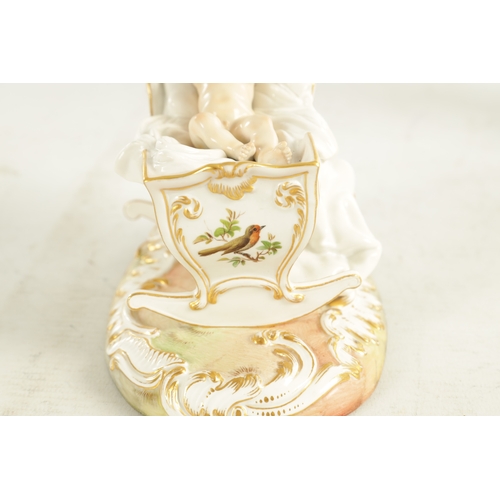 106 - A 19TH CENTURY MEISSEN CRADLE AND CHERUB FIGURE of elaborate design highlighted in gilt and set on a... 