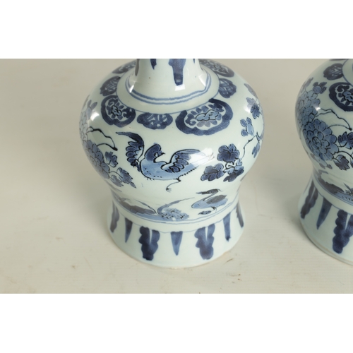 109 - A PAIR OF LATE 17TH CENTURY BLUE AND WHITE DELFT VASES having bulbous bodies with slender necks, dec... 