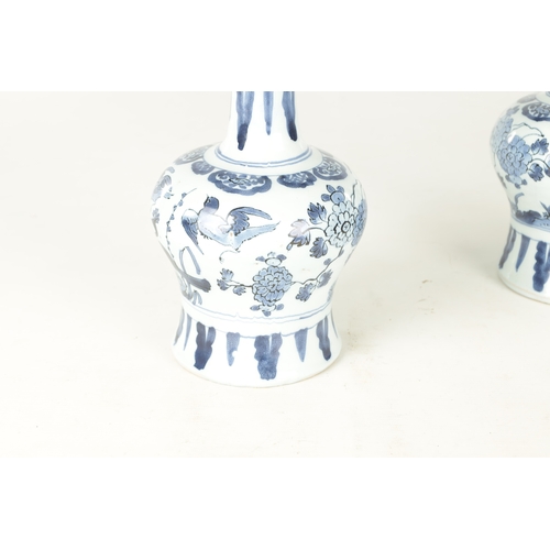 109 - A PAIR OF LATE 17TH CENTURY BLUE AND WHITE DELFT VASES having bulbous bodies with slender necks, dec... 