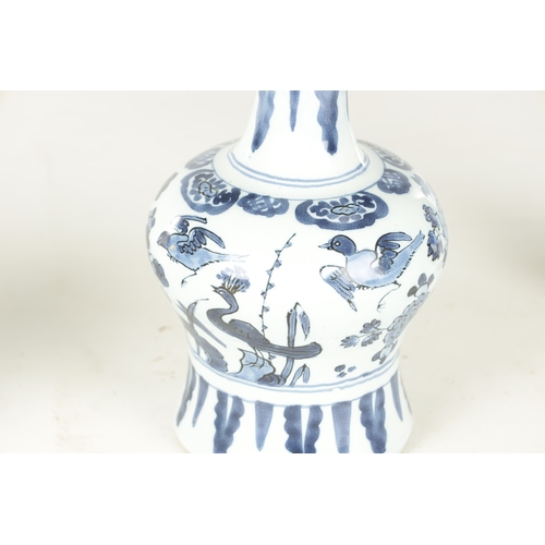 109 - A PAIR OF LATE 17TH CENTURY BLUE AND WHITE DELFT VASES having bulbous bodies with slender necks, dec... 